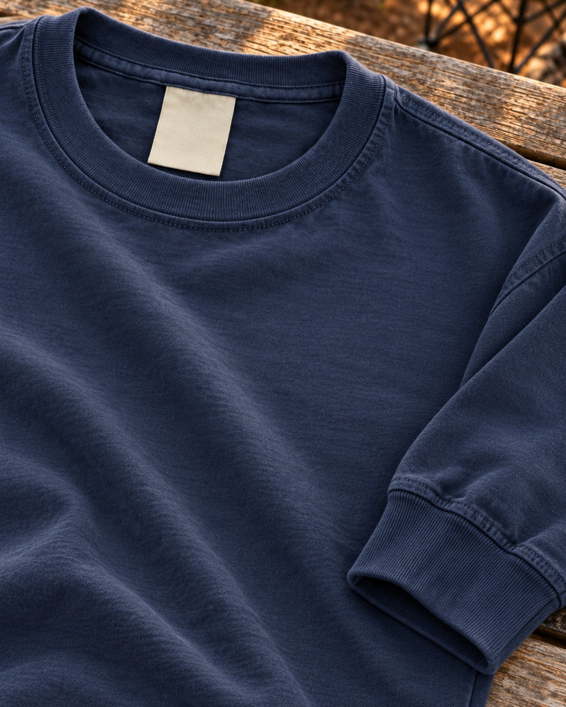 Navy long sleeve collar and cuff on a wooden bench