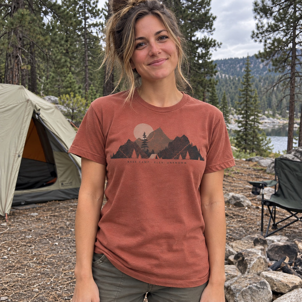Woman wearing the Base Camp Moon T-Shirt in Terracotta at a campsite