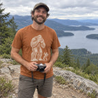 Man wearing the Bigfoot Photographer T-Shirt at a scenic overlook