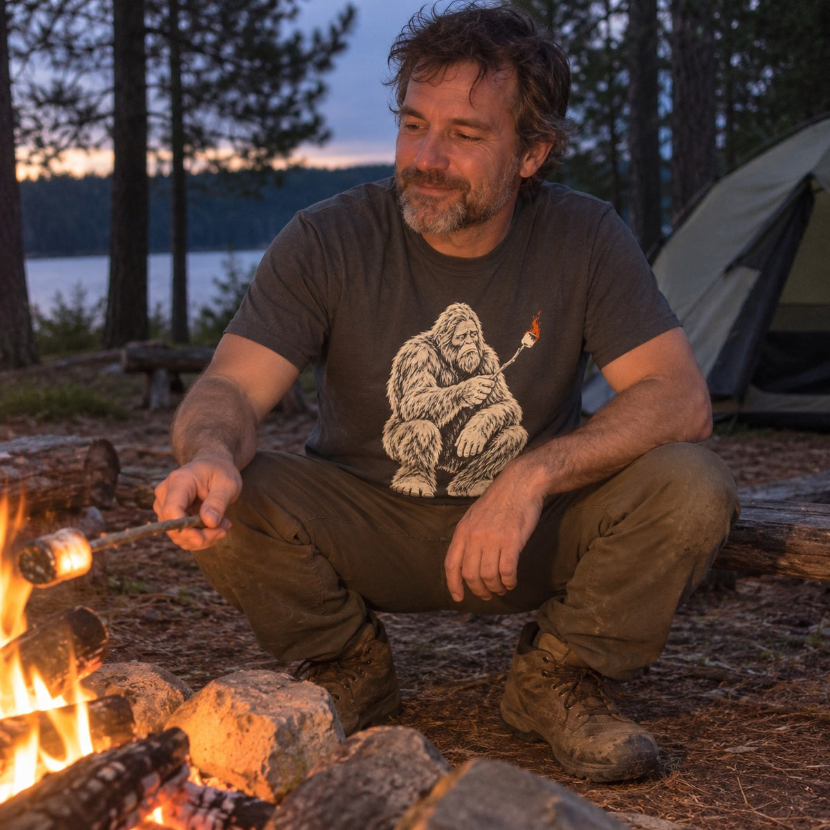 Man wearing the Bigfoot S'mores T-Shirt by a campfire