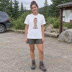 Woman wearing the One More Trail T-shirt at a trailhead parking area