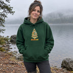 Woman wearing the Branch Out hoodie on a misty lakeshore in the morning