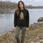 Woman wearing the Branch Out long sleeve shirt by a river bank