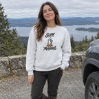 Woman wearing the Slow Mornings crewneck sweatshirt at a scenic pull-off by the car