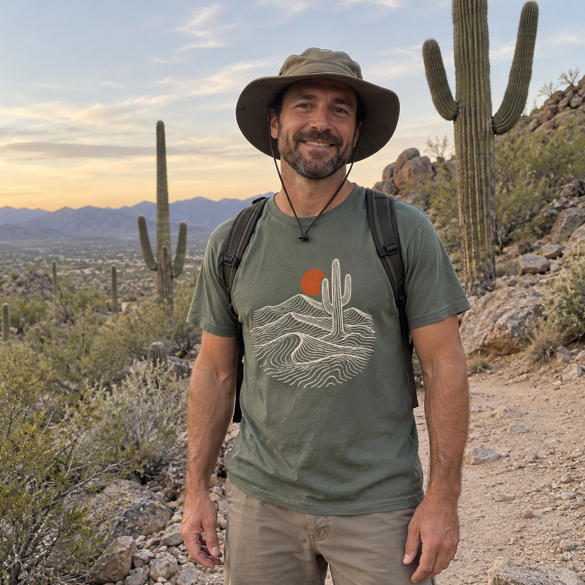 Man wearing the Desert Saguaro T-Shirt on a desert trail