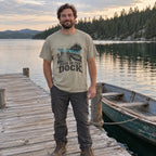 Man wearing the Dusk on the Dock T-shirt on a lake dock