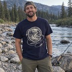 Fly Reel River T-Shirt worn on a riverbank