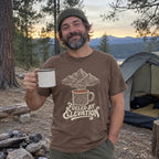Man wearing the Fueled by Elevation T-shirt outdoors