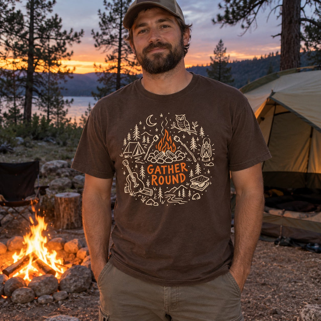 Man wearing the Gather Round T-shirt in Espresso by a campfire