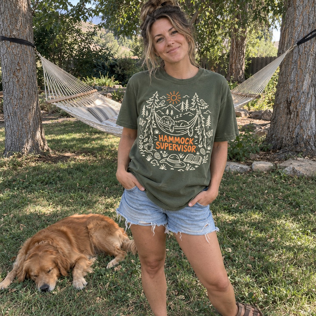 Woman wearing the Hammock Supervisor T-shirt in a backyard