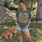 Woman wearing the Hammock Supervisor T-shirt in a backyard