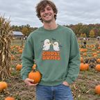 Man wearing the green Ghost Bumps sweatshirt at a pumpkin patch