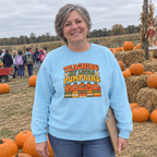 Woman wearing the light blue Teaching My Little Pumpkins sweatshirt on a pumpkin patch field trip