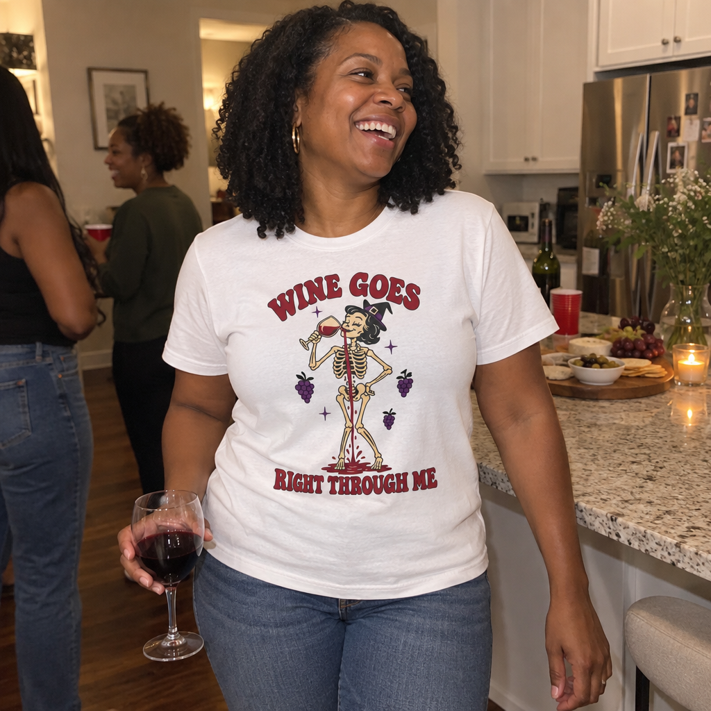 Woman wearing the white Wine Goes Right Through Me t-shirt at a girls' night in the kitchen
