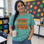 Woman wearing the seafoam Teaching My Little Pumpkins t-shirt in her classroom
