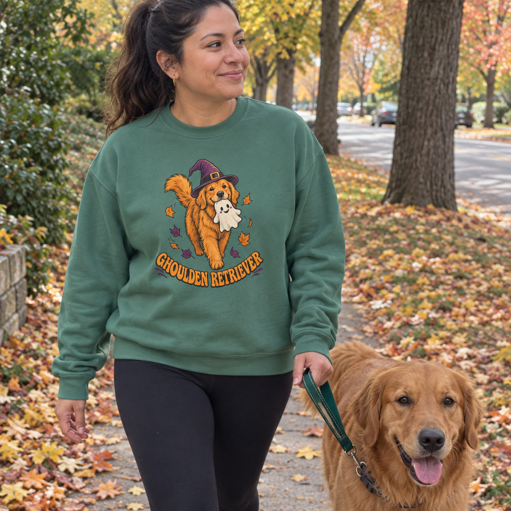 Woman wearing the Light Green Ghoulden Retriever sweatshirt walking her golden retriever