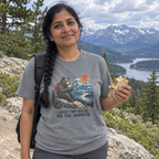 Woman wearing the gray Hiked Two Miles for This Sandwich t-shirt at a mountain trail overlook