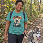 Woman wearing the Seafoam Part-Time Werewolf t-shirt hiking with her husky