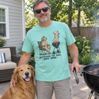 Man wearing the mint Supervising the Grill Since Noon t-shirt with his golden retriever