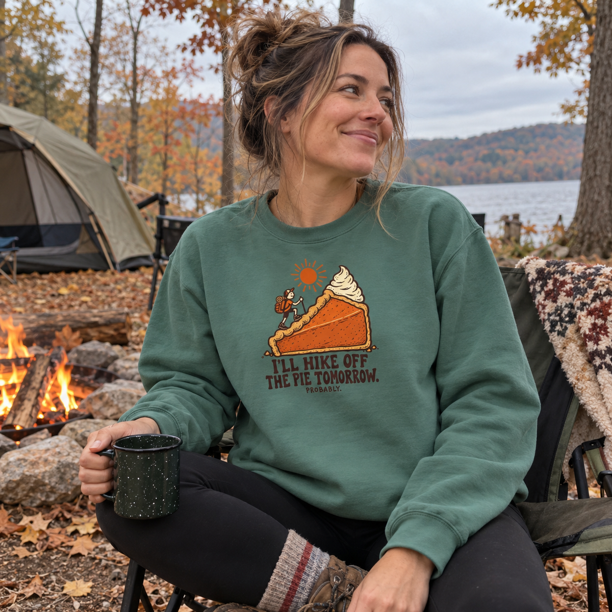 Woman wearing the Hike Off the Pie Sweatshirt at a fall campsite
