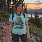 Woman wearing the Hoo's Out There T-shirt on a forest trail
