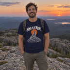 Man wearing the Howl at the Ridge T-shirt outdoors
