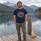 Man wearing the Lake Canoe T-Shirt on a lake dock