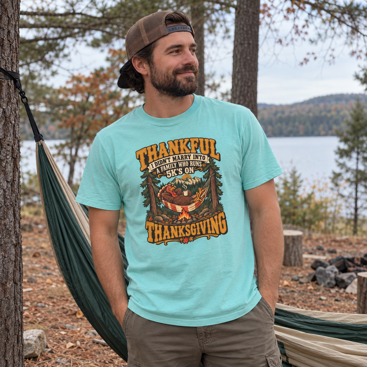 Man wearing the Not a 5K Family Turkey Hammock T-Shirt next to a hammock