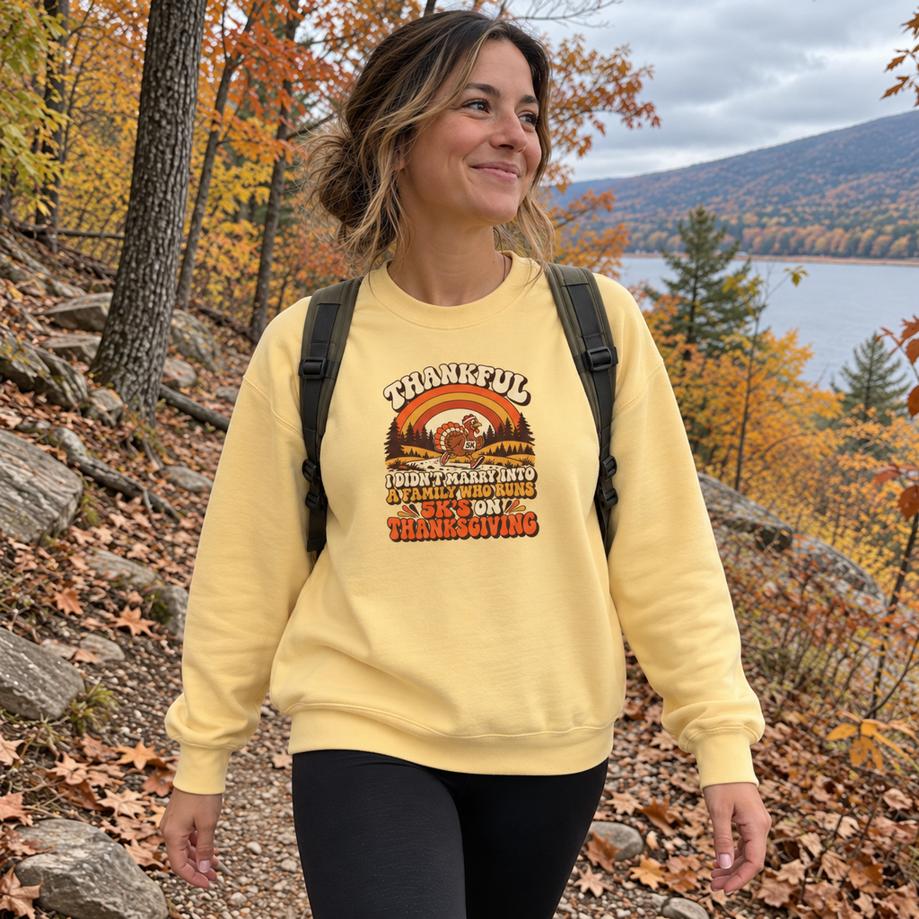 Woman wearing the Not a 5K Family Retro Sunset Sweatshirt on a fall trail