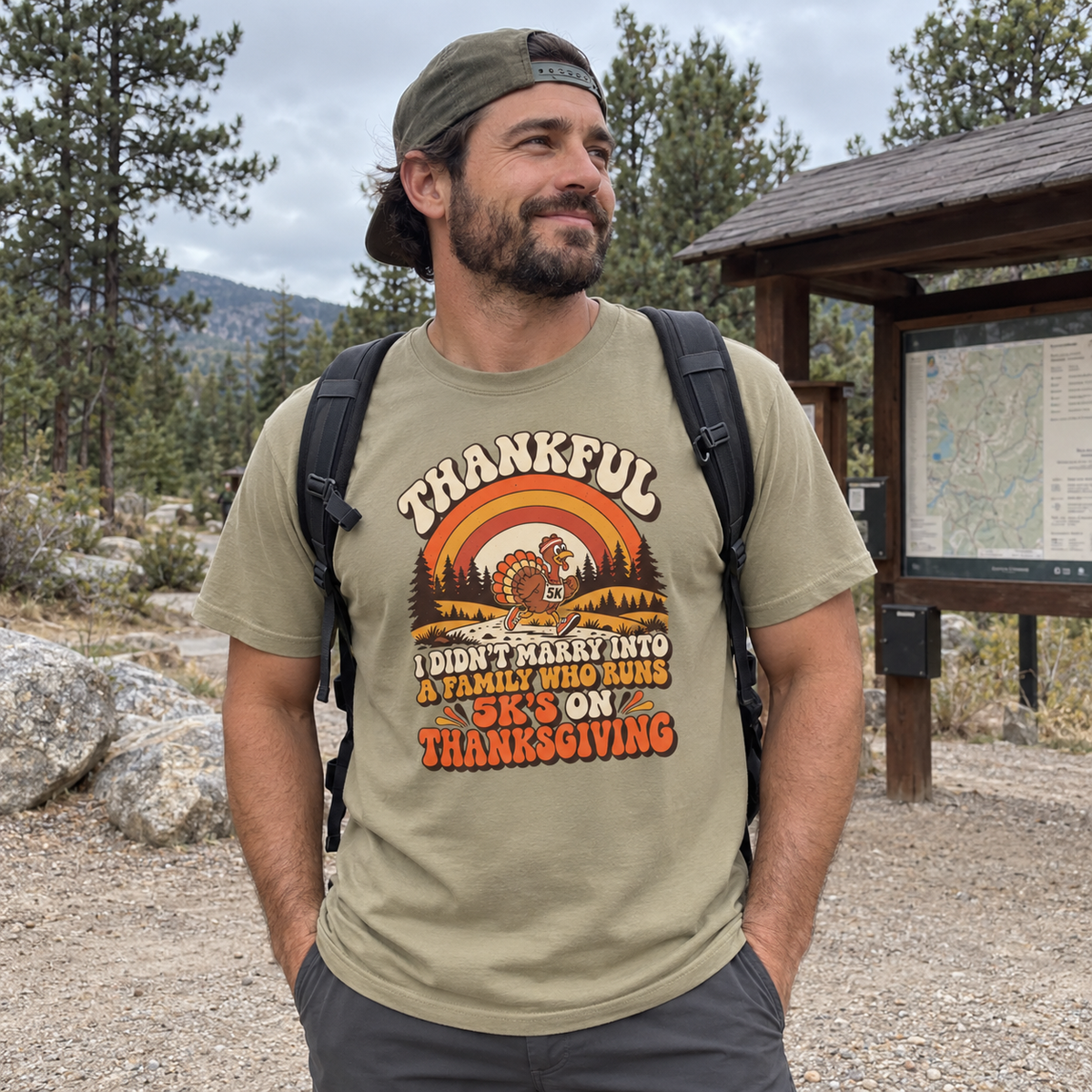 Man wearing the Not a 5K Family Retro Sunset T-Shirt at a trailhead