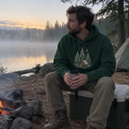 Camp Under the Pines Hoodie worn outdoors