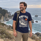 Man wearing the McWay Falls T-Shirt on the Big Sur coast