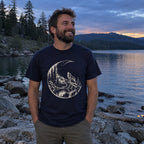 Moon Howl T-Shirt worn on a lakeshore