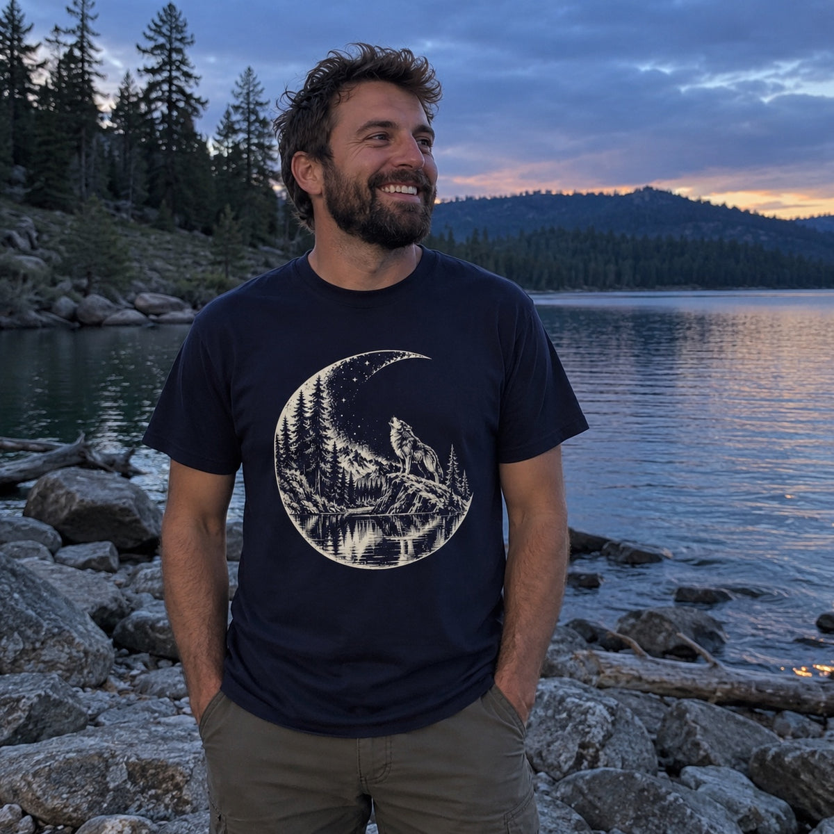 Moon Howl T-Shirt worn on a lakeshore
