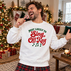 Most Likely To Sing Off Key Sweatshirt worn in a casual Christmas photo