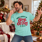 Most Likely To Sing Off Key T-Shirt worn in a casual Christmas photo