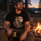Night Watch T-Shirt worn by a campfire