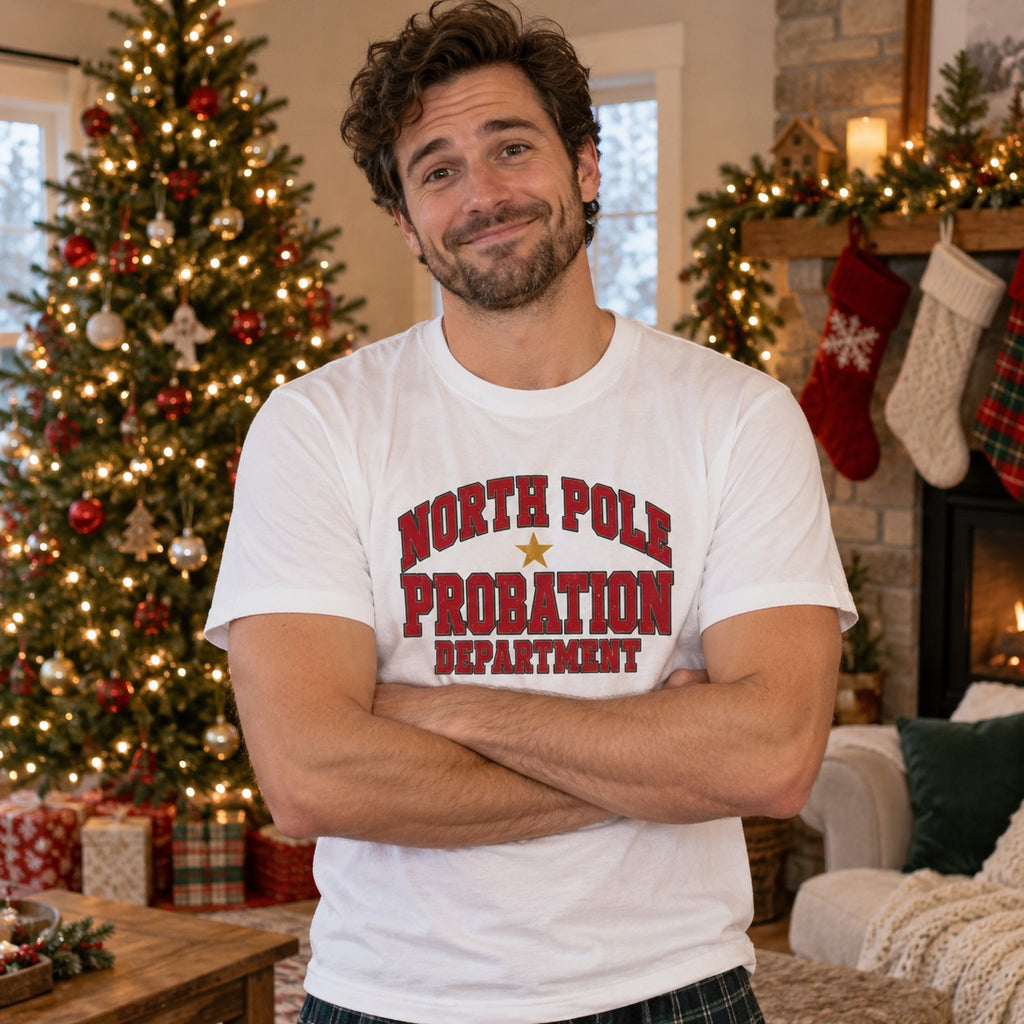 North Pole Probation Department T-Shirt worn in a casual Christmas photo