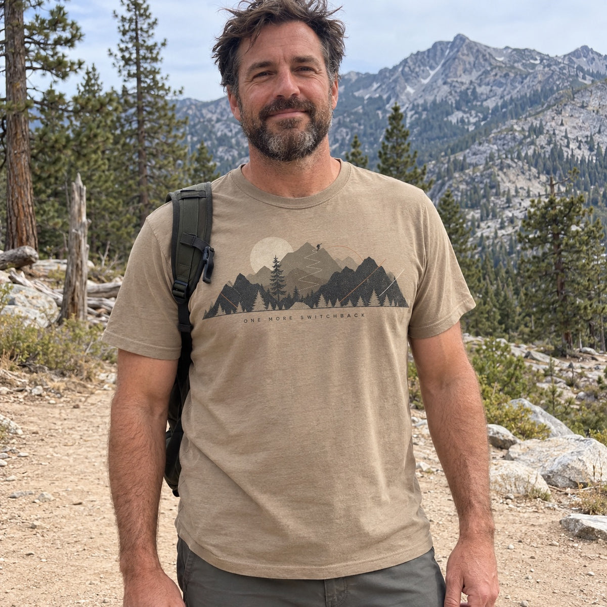 Man wearing the One More Switchback T-Shirt in Khaki at a trailhead