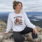 Woman wearing the Out of Breath Full of Pie Sweatshirt at a summit