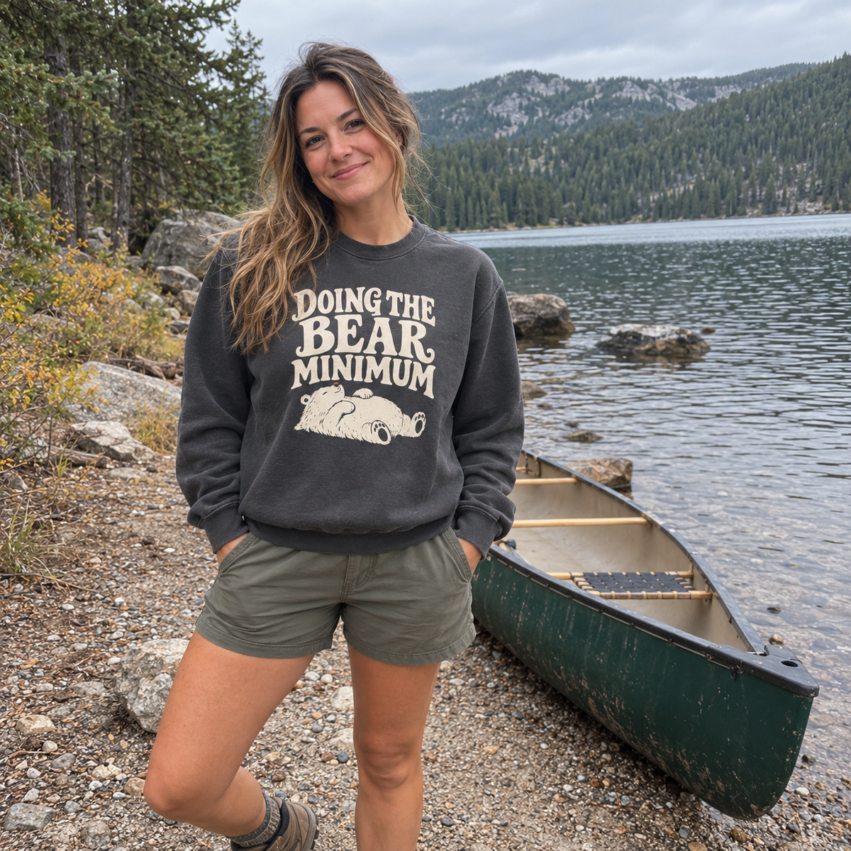 Woman wearing the Doing the Bear Minimum Sweatshirt outdoors