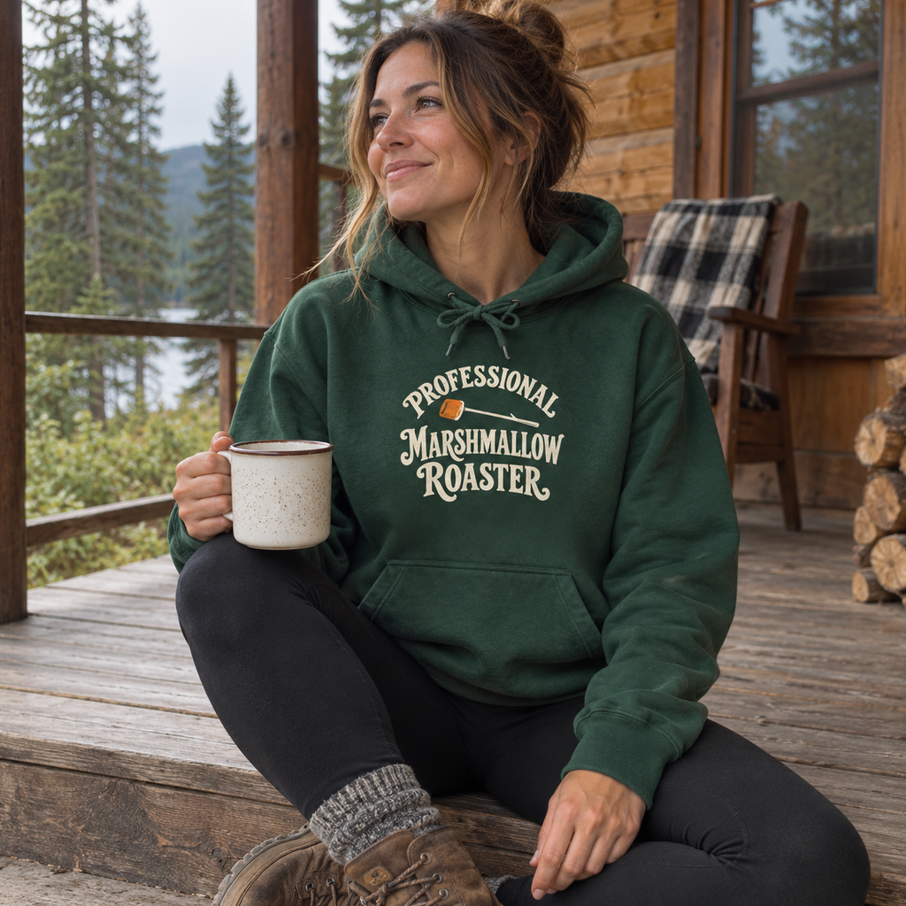 Woman wearing the Professional Marshmallow Roaster Hoodie on a cabin porch