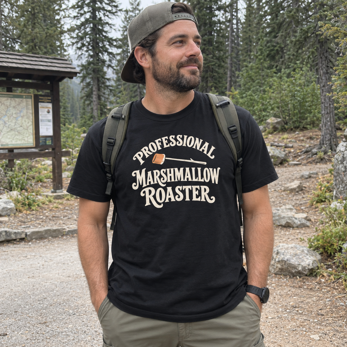 Man wearing the Professional Marshmallow Roaster T-Shirt at a campsite