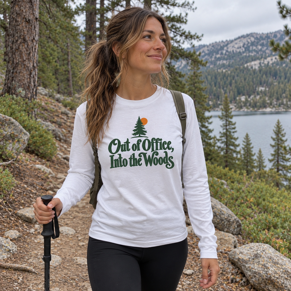 Woman wearing the Out of Office, Into the Woods Long Sleeve Shirt on a trail