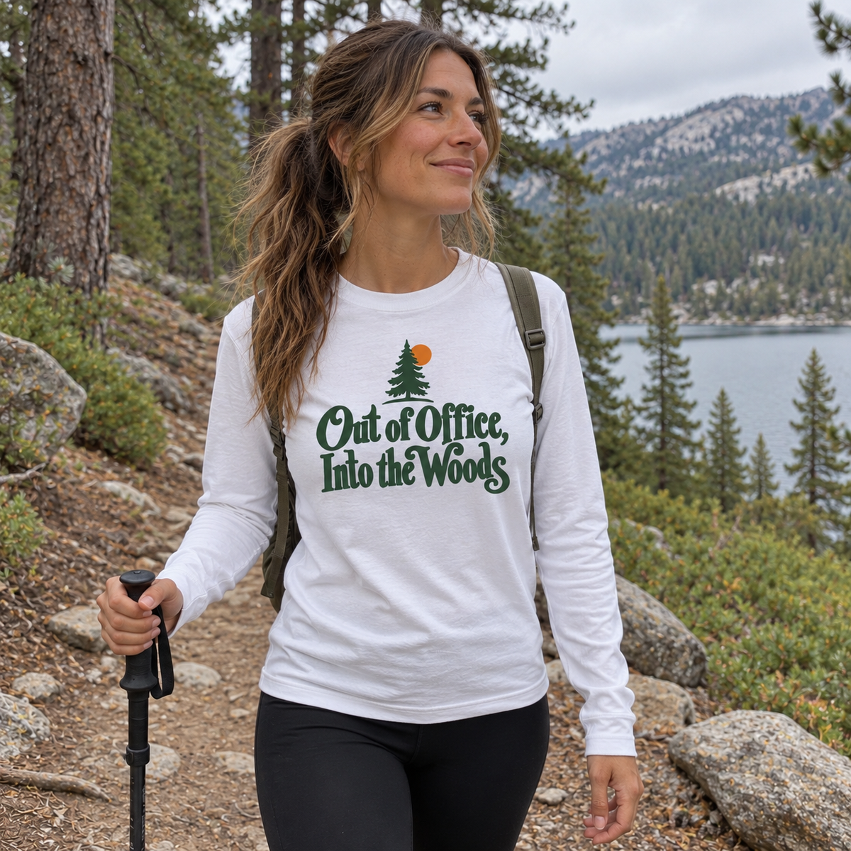 Woman wearing the Out of Office, Into the Woods Long Sleeve Shirt on a trail