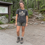 Woman wearing the Offline Until Further Notice T-Shirt at a campsite