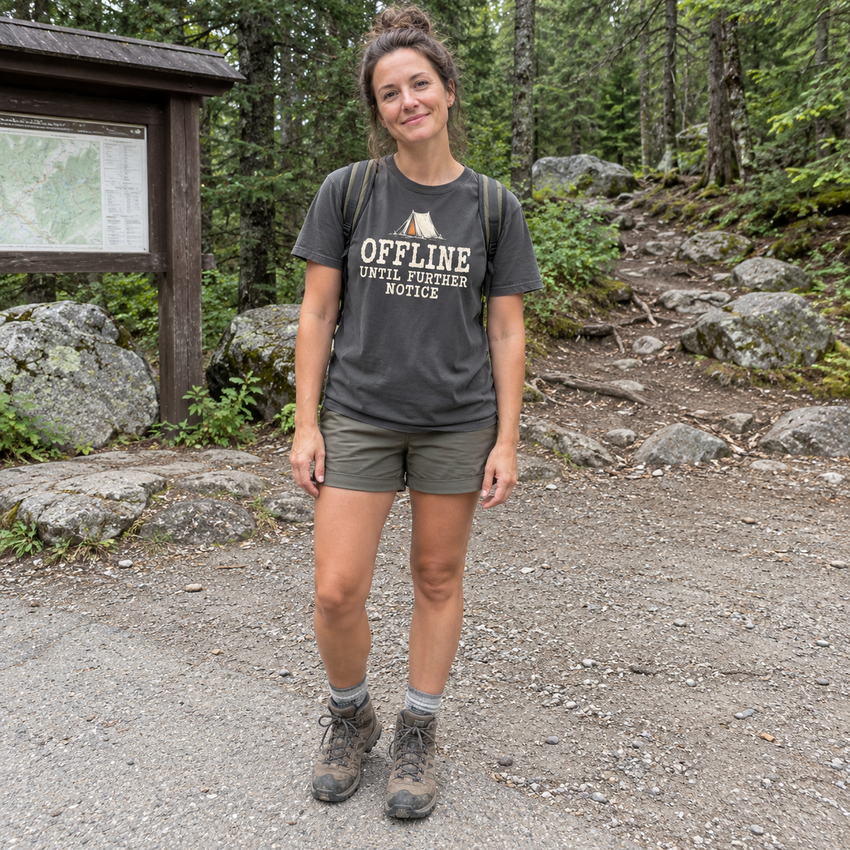 Woman wearing the Offline Until Further Notice T-Shirt at a campsite