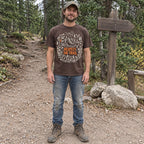 Man wearing the Respect the Trail T-Shirt in Espresso at a trailhead