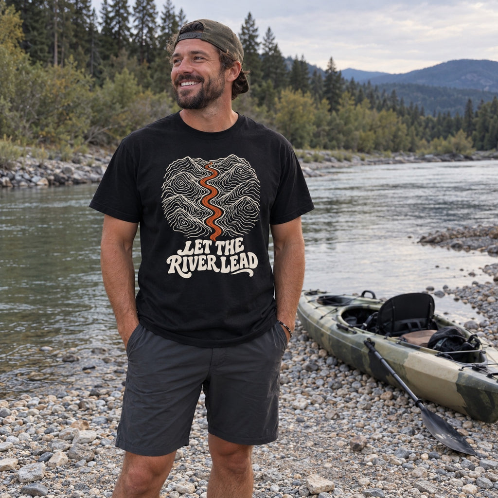 Man wearing the Let the River Lead T-shirt outdoors