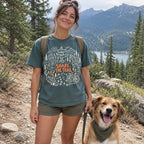 Woman wearing the Share the Trail T-Shirt in Blue Spruce with her dog on a trail